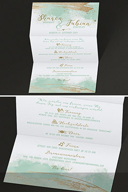 Die aufgeklappten, mintgrünen Einladungskarten zur Hochzeit